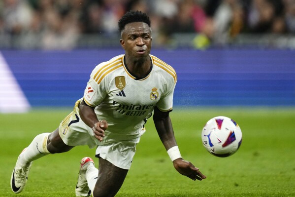 Vin cius Rodrygo lead Madrid s 5 1 rout of Valencia. Girona stays
